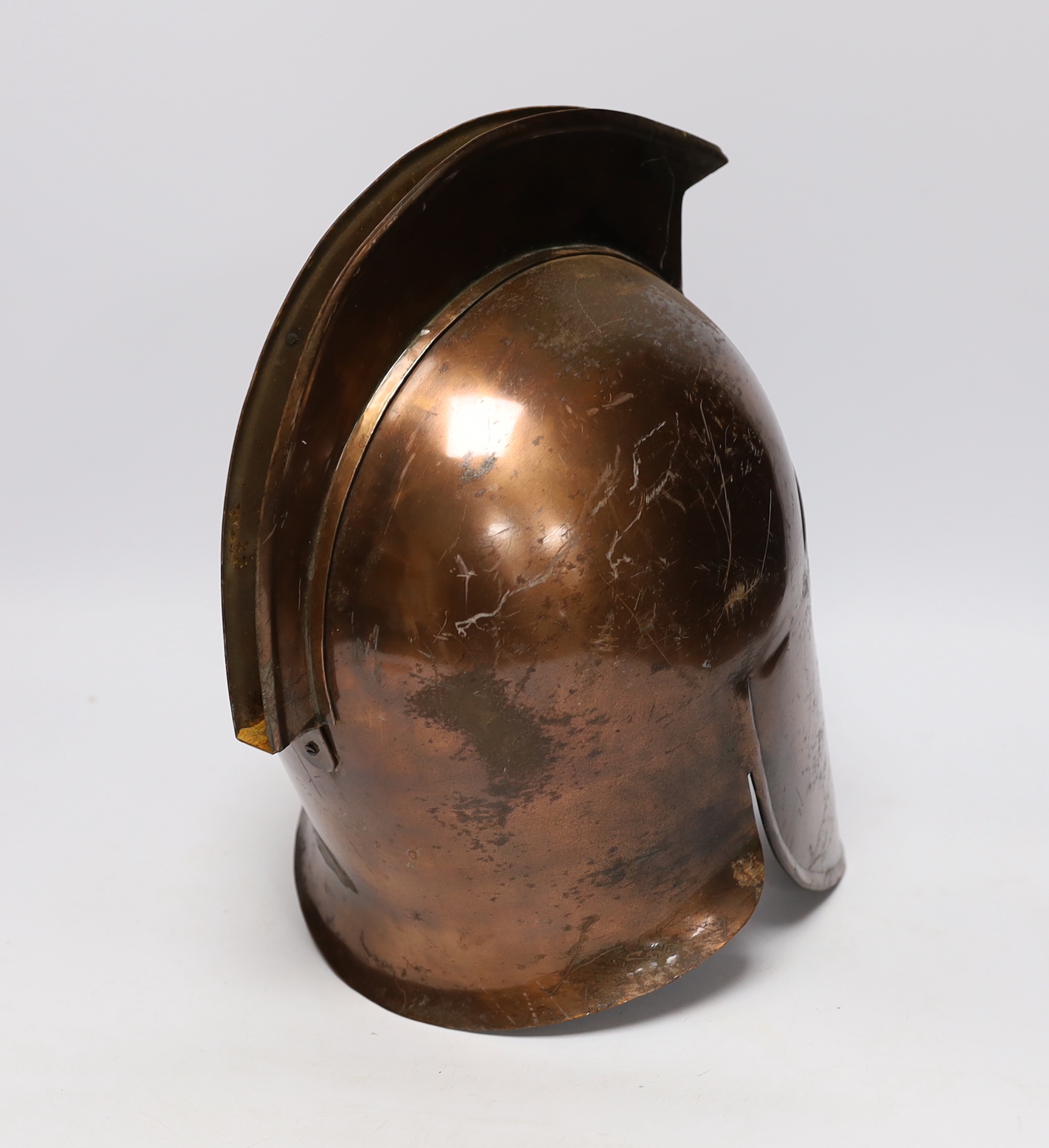 A copper gladiator's helmet, 32cm high